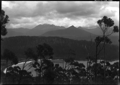 [Mountains, a lake, trees] [picture] : [Tasmania] / [Frank Hurley]