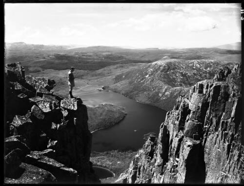 Dove Lake from summit, horizontal [with figure] [picture] : [Cradle Mountain, Tasmania] / [Frank Hurley]