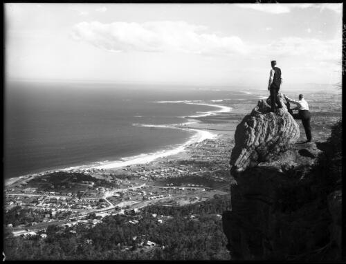 Panorama from Sublime Pt with two figures [picture] : [South Coast, New South Wales] / [Frank Hurley]