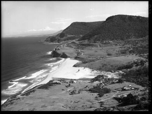 Stanwell Park from Bald Hill [with beach and fence across paddock in foreground] [picture] : [South Coast, New South Wales] / [Frank Hurley]