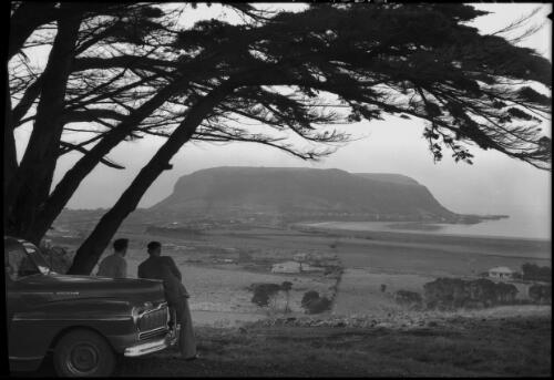The Nut, Stanley Tas., N.W. Coast [with two men leaning on a car] [picture] : [North West Coast, Tasmania] / [Frank Hurley]