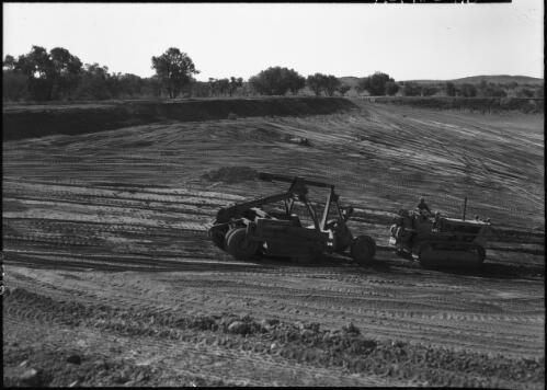 [Excavating a huge dam with a caterpillar tractor on the Hastings Deering property, 1] [picture] : [Central Australia] / [Frank Hurley]