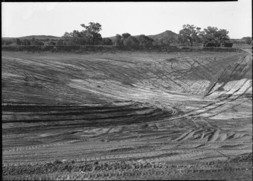 [Excavating a huge dam with a caterpillar tractor on the Hastings Deering property, 2] [picture] : [Central Australia] / [Frank Hurley]