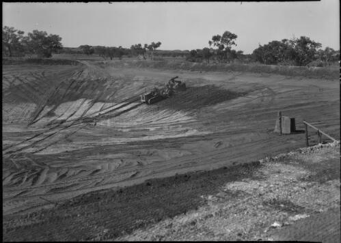 [Excavating a huge dam with a caterpillar tractor on the Hastings Deering property, 3] [picture] : [Central Australia] / [Frank Hurley]
