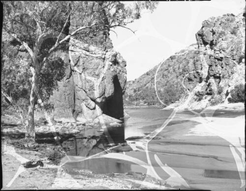 Glen Helen [hills, rocks, tree, water] [picture] : [Central Australia] / [Frank Hurley]