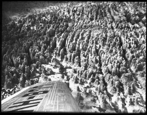 Lost City, Arnhem Land [aerial shot with part of plane wing, 1] [picture] : [Northern Territory] / [Frank Hurley]