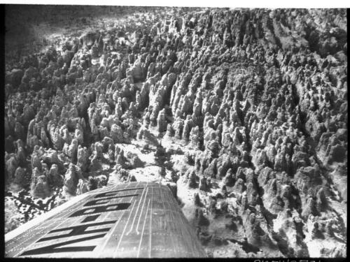 Lost City, Arnhem Land [aerial shot with part of plane wing, 2] [picture] : [Northern Territory] / [Frank Hurley]