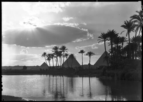 Sunset at the Pyramids [with palms reflected in the Nile River] [picture] : [Cairo, Egypt, World War II] / [Frank Hurley]