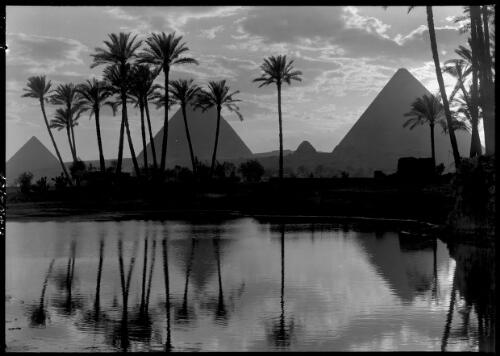 [The Pyramids with palms reflected in the Nile River] [picture] : [Cairo, Egypt, World War II] / [Frank Hurley]