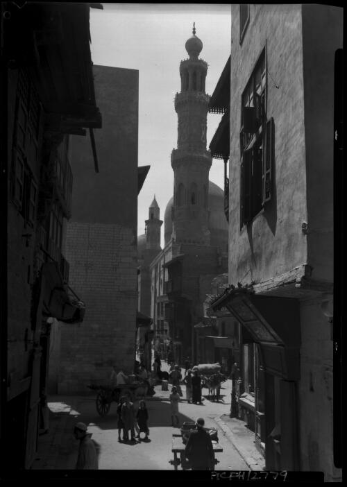 [A street in old Cairo, with minarets in the background, figures, hores and carts] [picture] : [Cairo, Egypt, World War II] / [Frank Hurley]