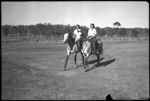 [Unidentified women on horses riding side by side, 1] [picture] / [Frank Hurley]