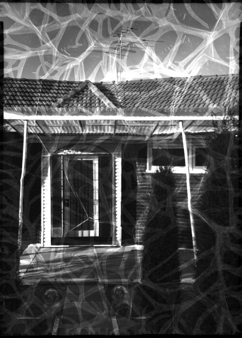 [Doorway of a weatherboard house, 2] [picture] / [Frank Hurley]