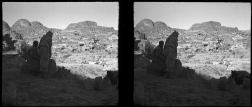 General view looking north [Petra, two figures in Arab dress] [picture] : [Jordan, World War II] / [Frank Hurley]