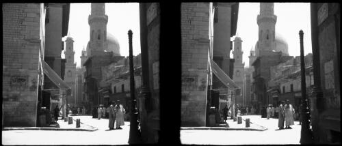 [City street scene with pedestrian traffic, shops, temple, mosque, towers, minarets] [picture] : [Egypt, World War II] / [Frank Hurley]