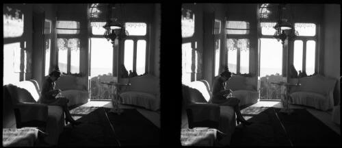 In the Palace hotel Becharre [woman seated, knitting] [picture] : [Lebanon, World War II] / [Frank Hurley]
