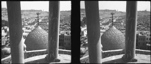 Looking down from the Minaret of Quait Bay Mosque. Note the beautiful carving on dome, Tombs Khalifs Cairo [picture] : [Egypt, World War II] / [Frank Hurley]