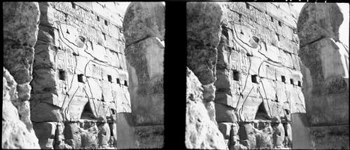 Fine reliefs on the exterior of the Hypostyle Hall, Temple of Karnak, which tell the story of Sety 1st [Seti] reconquering Asiatic nations lost to Egypt by the pharaoh Akhnaton [Akhenaton], stereos [wall relief] [picture] : [Egypt, World War II] / [Frank Hurley]