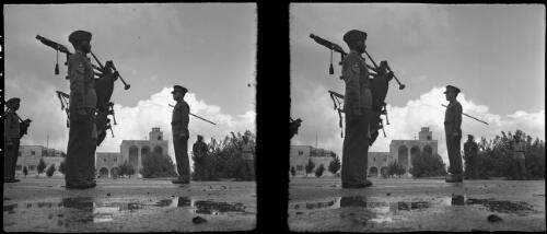 Senussi [Sanusi] training centre at Oberdan Cyrenaica [bagpipe players close-up] [picture] : [Libya, World War II] / [Frank Hurley]