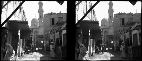 Cairo [street scene, minaret and dome of building up ahead] [picture] : [Egypt, World War II] / [Frank Hurley]
