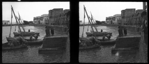Rouad Isld. [boats docking, wharfside] [picture] : [Syria, World War II] / [Frank Hurley]