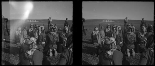 With the Arab Legion, TransJordan [group of men kneeling, at a shooting range] [picture] : [Jordan, World War II] / [Frank Hurley]