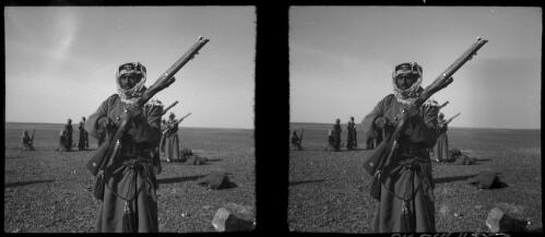 With the Arab Legion, TransJordan [portrait of a man with a rifle] [picture] : [Jordan, World War II] / [Frank Hurley]