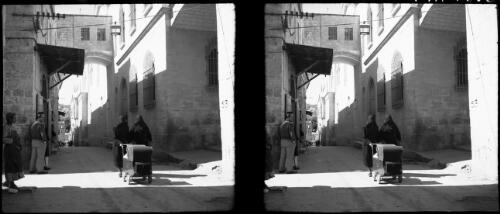 Scenes in Via Dolorosa [two women with a baby carriage] [picture] / [Frank Hurley]