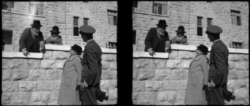 Scenes in Jerusalem mostly portrait stuff [portrait, three men, one in military uniform, one woman] [picture] / [Frank Hurley]
