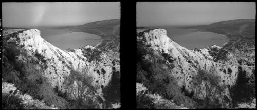 Scenes at Ras. Bayada Syria, where the road follows the cliff face he passes through a long tunnel [looking down into the bay] [picture] : [Syria, World War II] / [Frank Hurley]