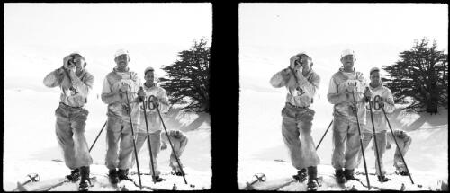 On the snow playground of the Lebanons, at the Cedars [four figures on skis, one taking photograph] [picture] : [Lebanon, World War II] / [Frank Hurley]