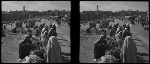 Damascus Gate, Mount of Olives [Jerusalem, figures by the roadside with food produce] [picture] / [Frank Hurley]