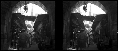 Cairo [view down an alleyway, shops opening onto the street] [picture] : [Egypt, World War II] / [Frank Hurley]