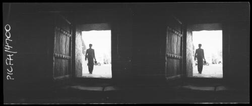 Bethlehem, Church [view through a door, a man walking towards the camera] [picture] / [Frank Hurley]