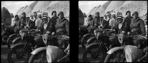 Damus, Nirab [Syrian villagers get a ride with Australian motor cycle riders The Provost Corps] [picture] : [Syria, World War II] / [Frank Hurley]