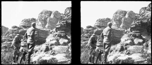 El Khazne, Petra [three men looking up to the ruins] [picture] : [Jordan, World War II] / [Frank Hurley]