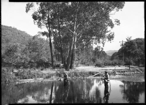 [Unidentified men fishing in a river] [picture] / [Frank Hurley]