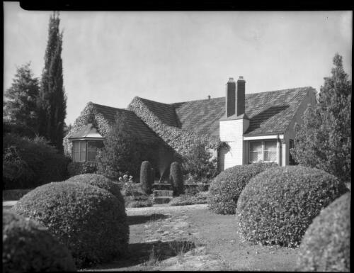 [Exterior of a house with a topiary garden, Australia] [picture] / [Frank Hurley]