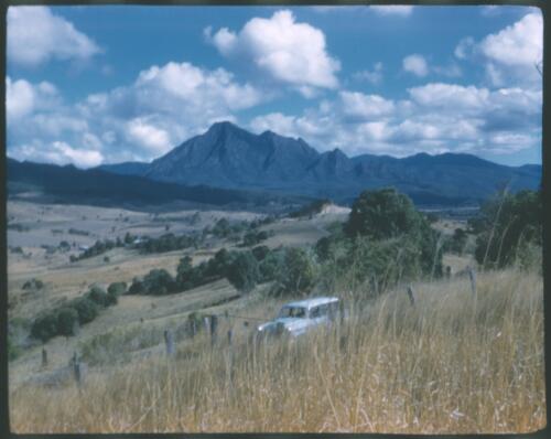 [Mount Lindesay region, with 1960s Holden station wagon, New South Wales. 2] [transparency] / [Frank Hurley]