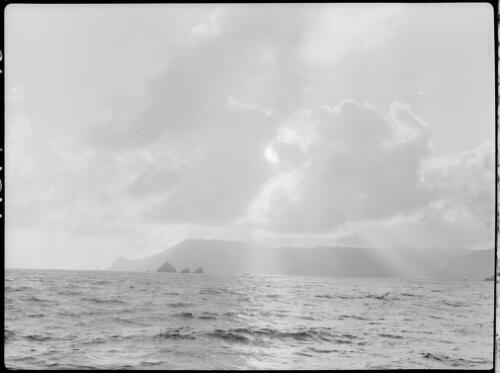 Clouds and sunbeams over sea and land, South West Cape, Tasmania, 1939, 2 [picture] / [Frank Hurley]
