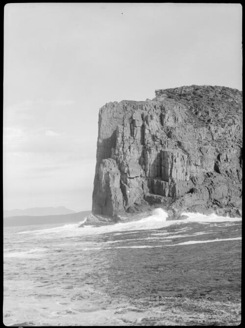 [Rocky cape or bluff and sea, rock on left, Maatsuyker Island?] [picture] : [South Coast, Tasmania] / [Frank Hurley]