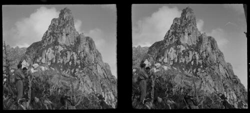 [Five figures in foreground, three standing and two sitting, with mountain in background ca. 1938-1947] [picture] : [Tasmania] / [Frank Hurley]