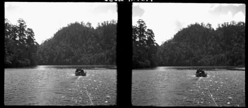 [Two figures in a rowing boat being towed, ca. 1938-1947] [picture] : [Tasmania] / [Frank Hurley]
