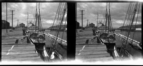 [Moored yachts at a dock, including the Taynna Hobart, and a large warehouse Ocean Pier No. 1 Shed, ca. 1938-1947] [picture] : [Tasmania] / [Frank Hurley]