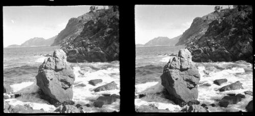 [Large rocks on the edge of water, landform to the right middleground and distant peninsula ca. 1938-1947, 2] [picture] : [Tasmania] / [Frank Hurley]