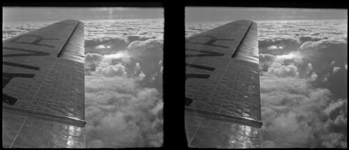 [Shot taken from inside aeroplane showing the aircraft wing with ANR visible, ca. 1938-1947] [picture] : [Tasmania] / [Frank Hurley]