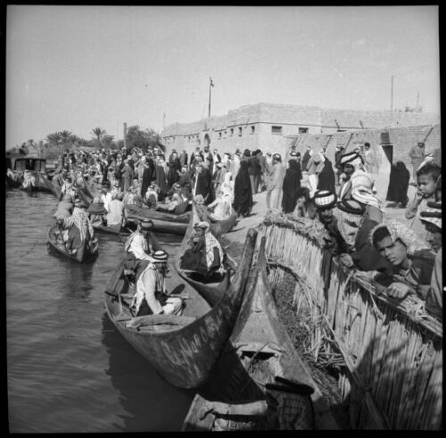 Chubaish & vicinity, sundry shots [long shot of river, canoe with figures, distant shore with houses, 1944] [picture] : [Iraq, World War II] / [Frank Hurley]