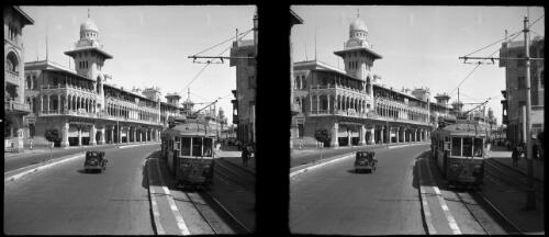 Almarza, glimpse Heliopolis [a tram and a car on a street] [picture] : [Cairo, Egypt, World War II] / [Frank Hurley]
