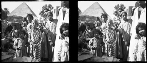 Children of Mena Village Cairo [with a pyramid in the background] [picture] : [Cairo, Egypt, World War II] / [Frank Hurley]