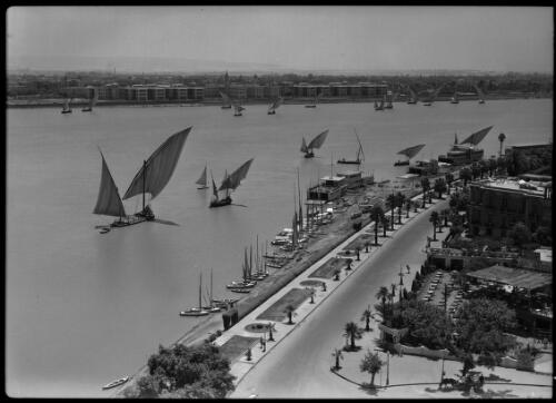 Feluccas on the Nile at Cairo [with a road in foreground, 1] [picture] : [Cairo, Egypt, World War II] / [Frank Hurley]