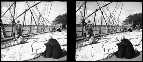 Mending felucca sail on Quayside near Cairo [picture] : [Cairo, Egypt, World War II] / [Frank Hurley]